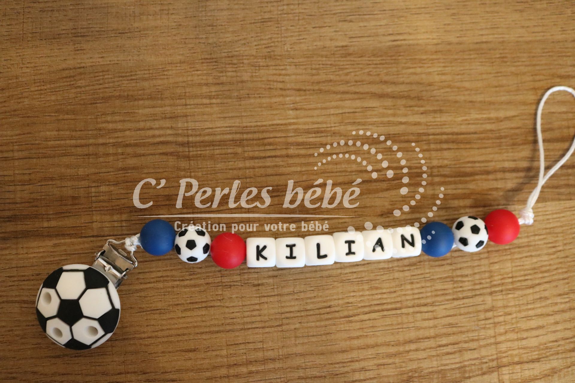 Attache tétine foot