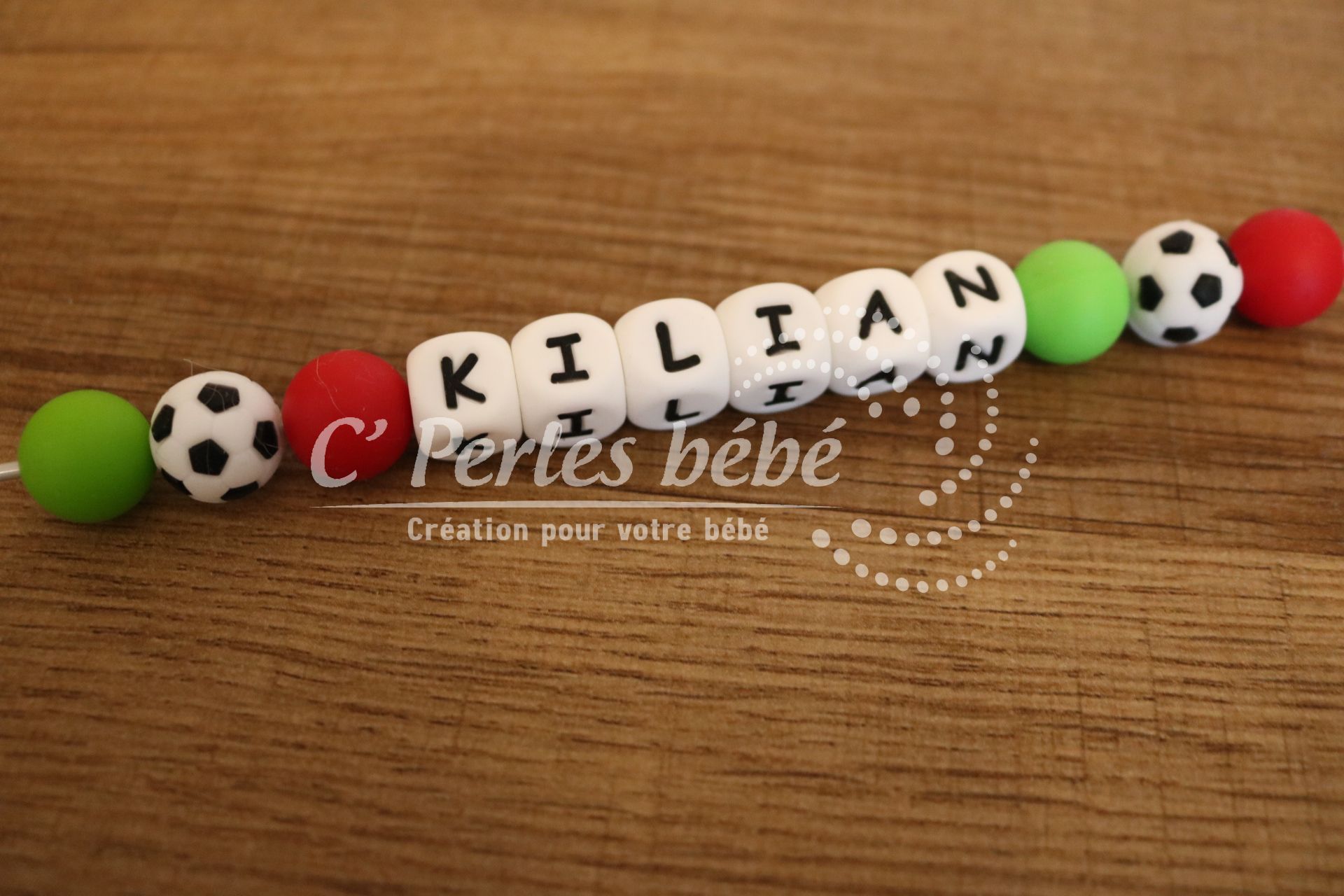 Attache tétine foot