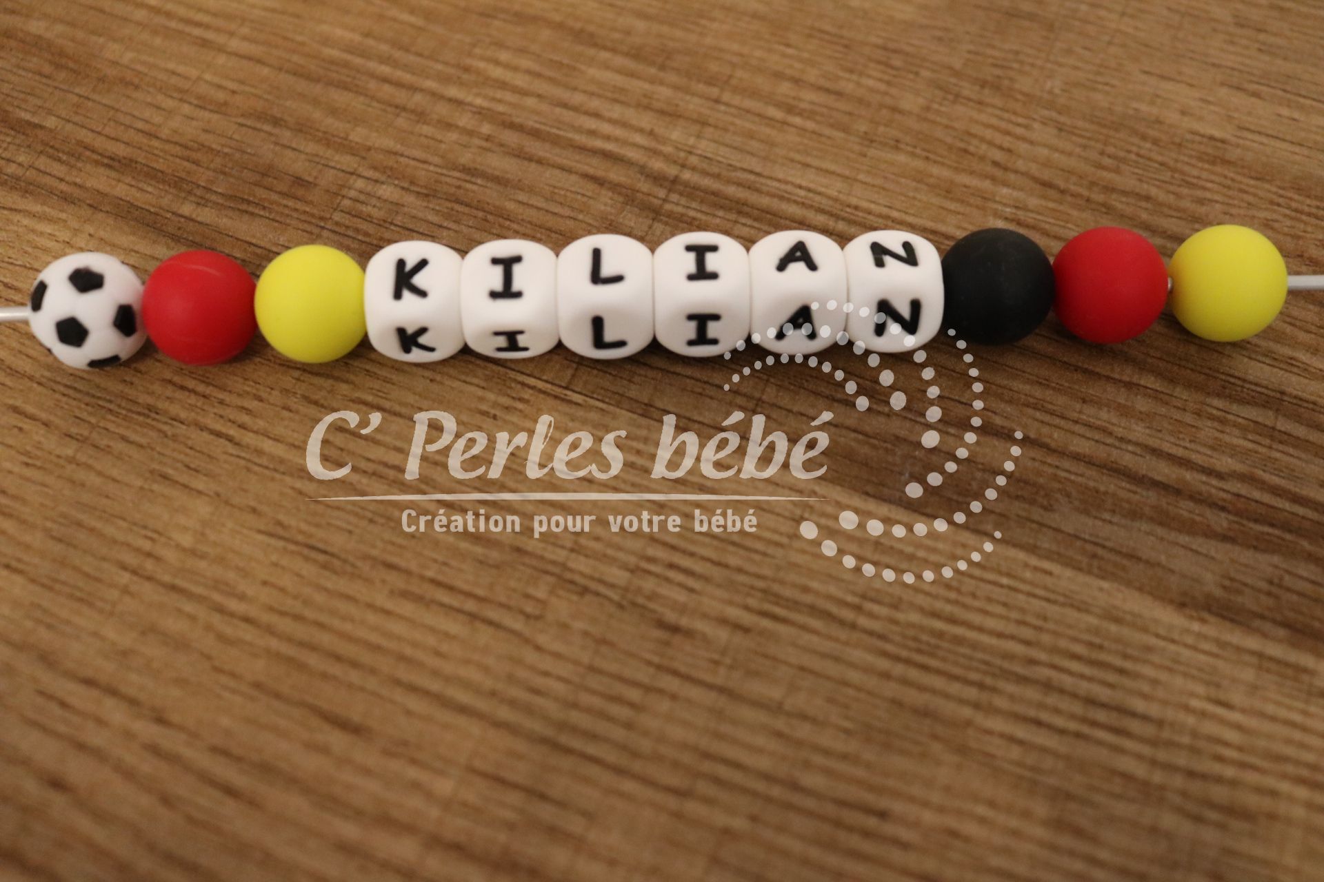 Attache tétine foot