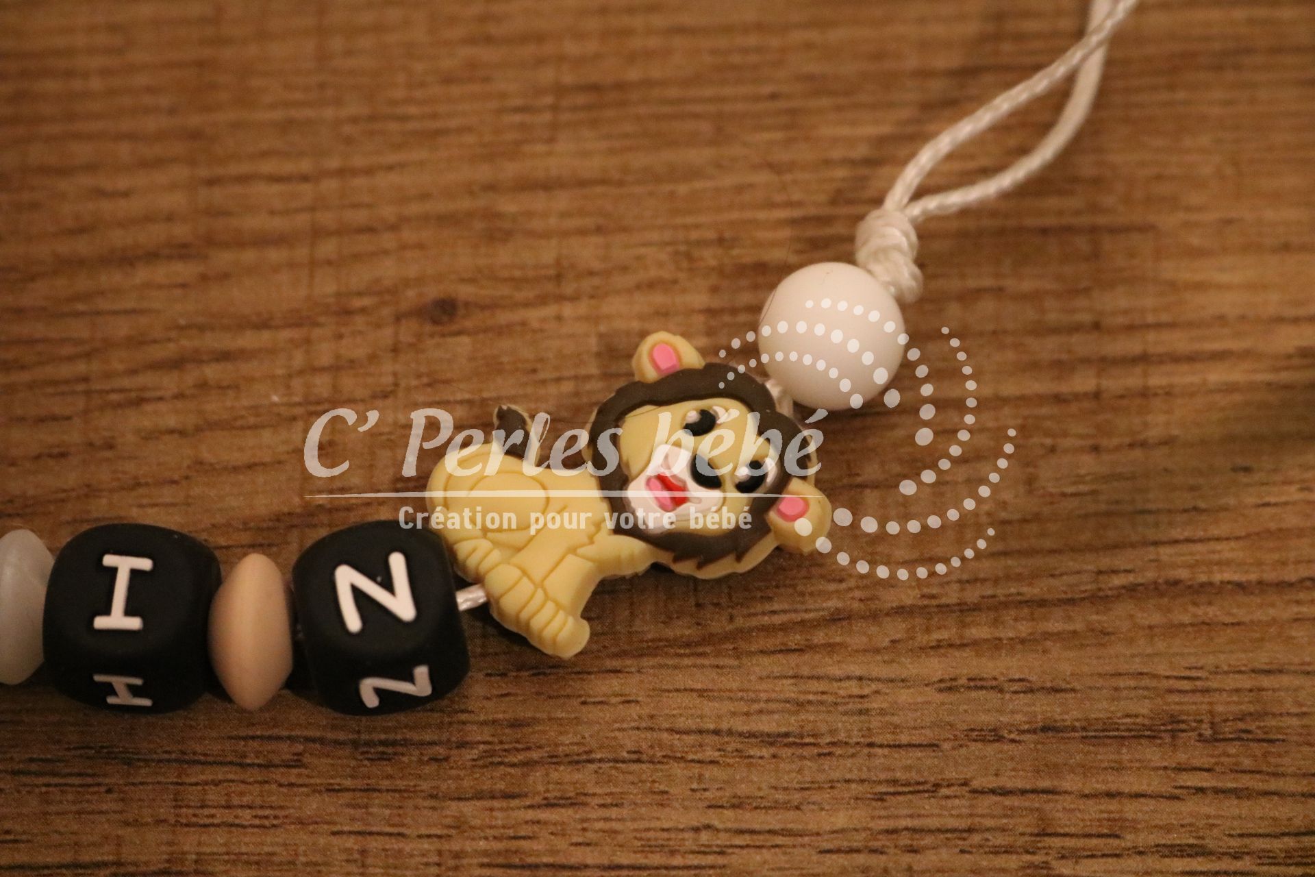 Attache tétine lion