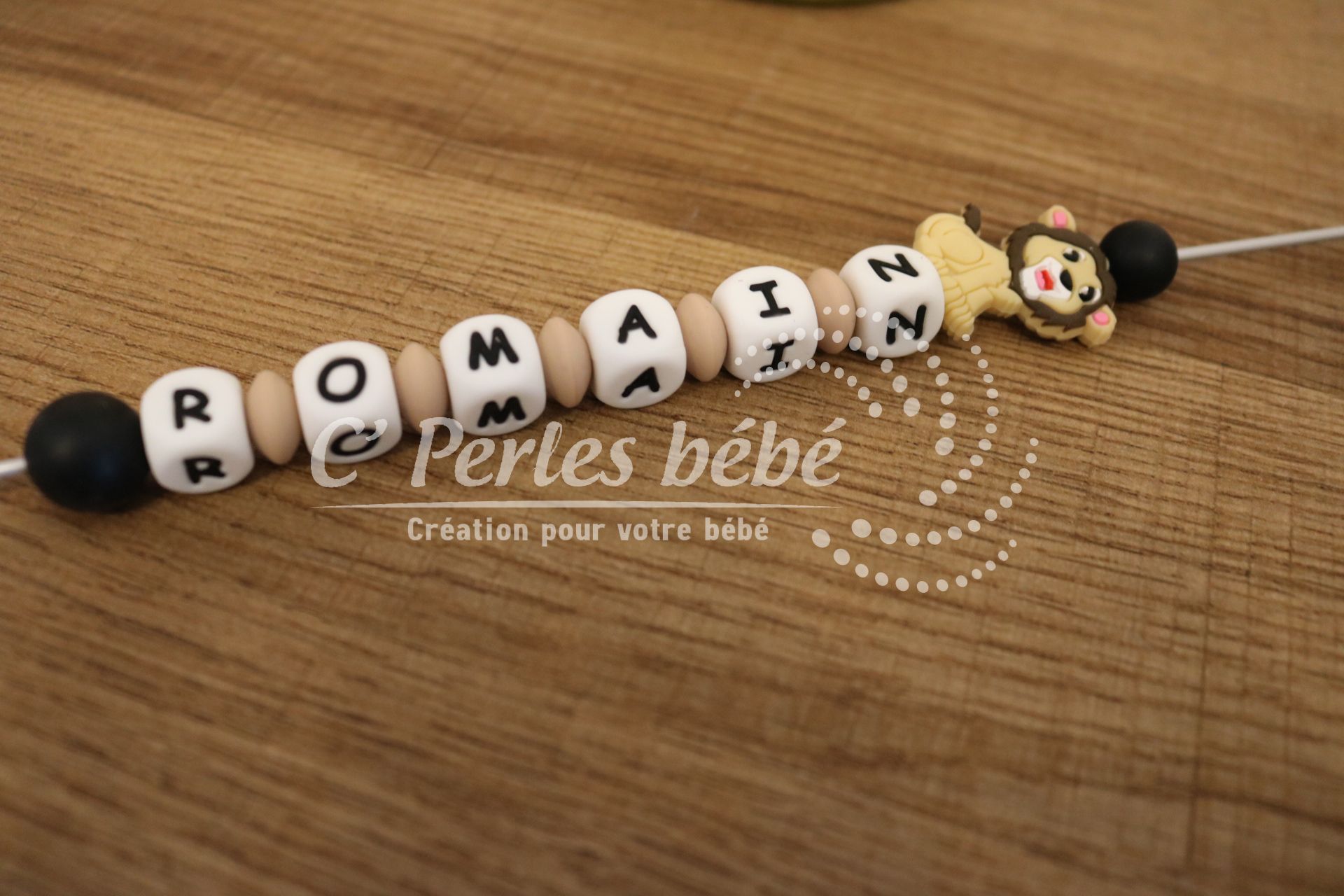 Attache tétine lion