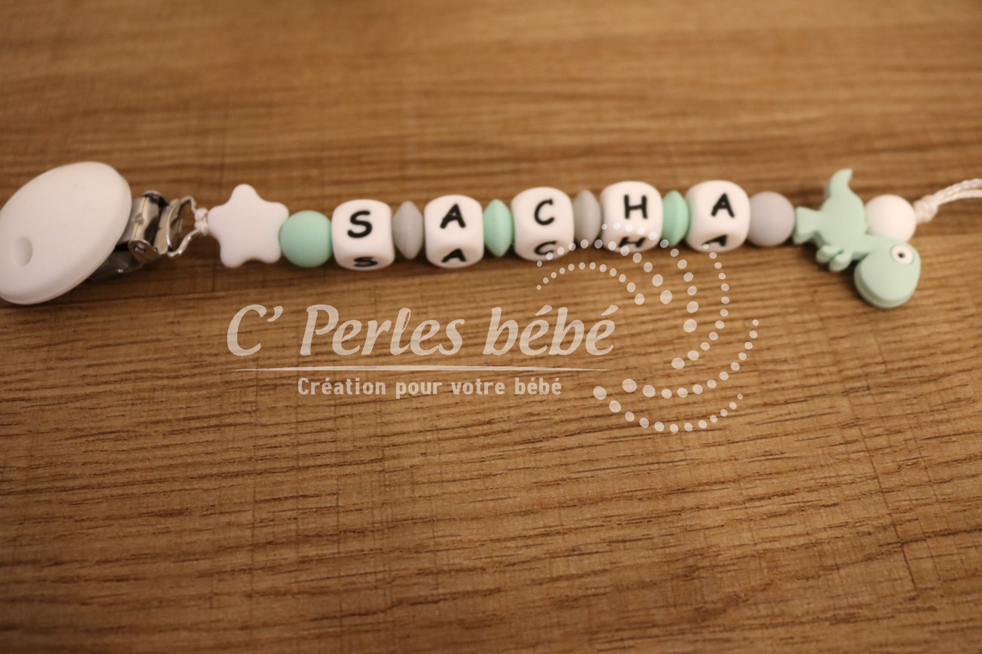 Attache tétine dinosaure