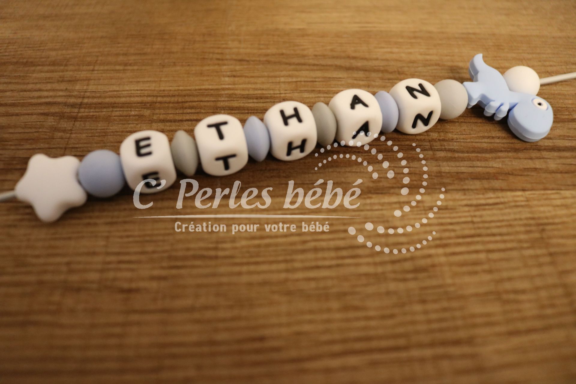 Attache tétine dinosaure