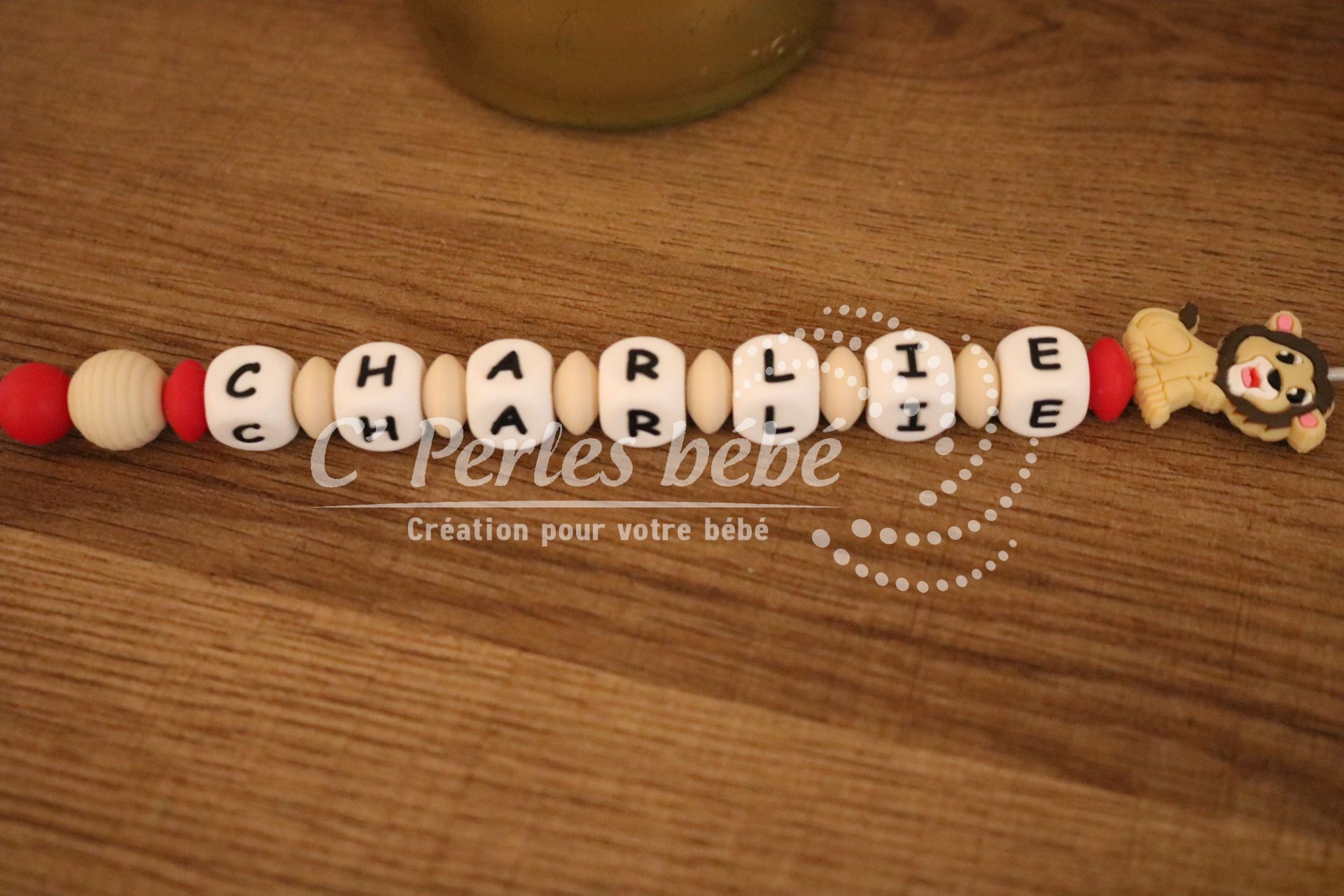 Attache tétine lion personnalisé