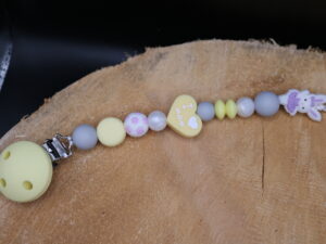 Attache tétine classique lapin danseur